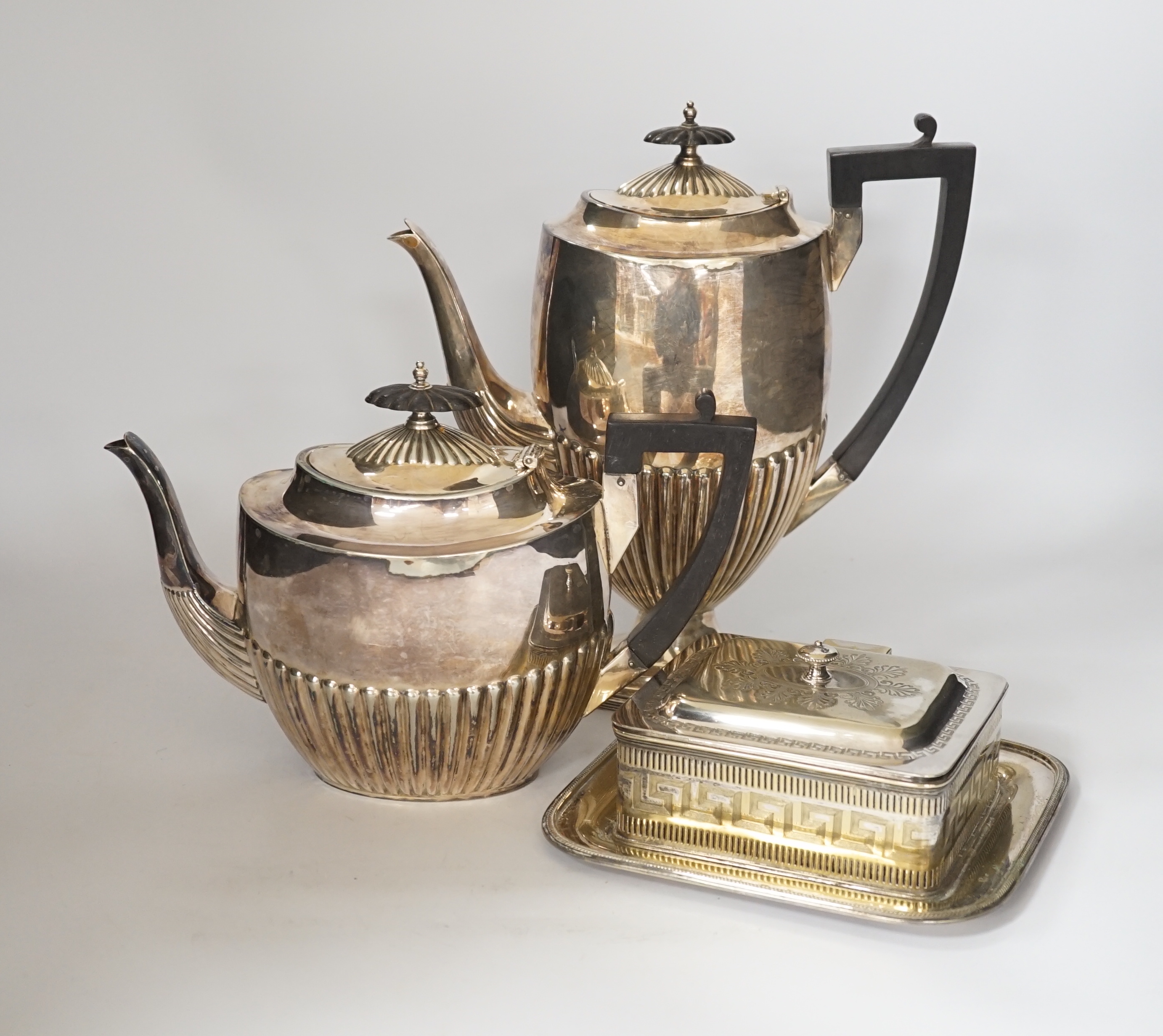 A plated four piece tea set tea, Danish candle holders, dishes salts etc